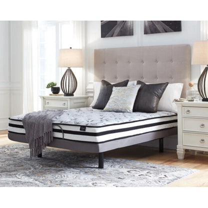 A room setting featuring Ashley Chime 8 Inch Innerspring Twin Mattress