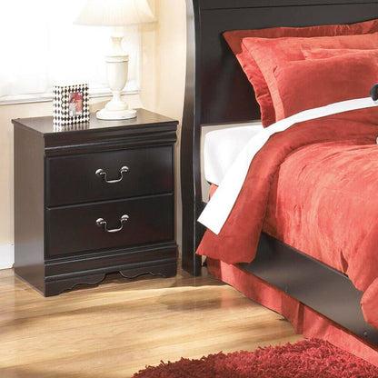 A room setting featuring Huey Vineyard Black Nightstand