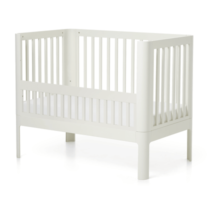 FLEXA NOVA baby bed safety rail in cream, modern slatted design, shown on white; child-safe feature visible.